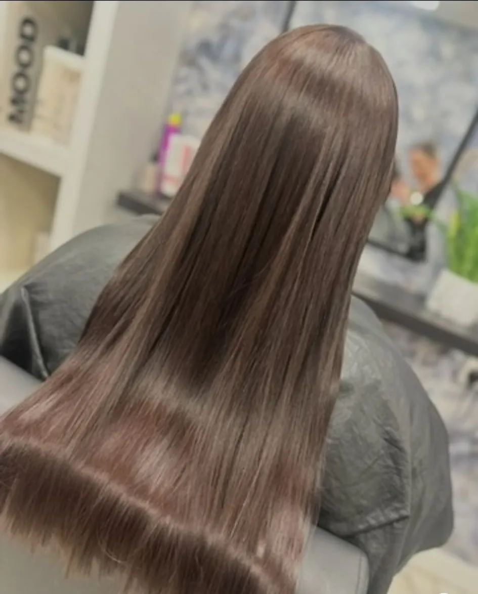 Sleek straight long chocolate brown hair with a glossy salon finish